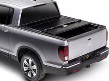 Load image into Gallery viewer, RealTruck BakFlip F1 Hard Folding Tonneau Cover Silverado Sierra 2500/3500HD
