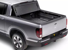 Load image into Gallery viewer, RealTruck BakFlip F1 Hard Folding Tonneau Cover Silverado Sierra 2500/3500HD