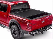 Load image into Gallery viewer, RealTruck Roll-N-Lock M-Series Manual Retractable Tonneau Cover Silverado Sierra 2500/3500HD