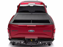 Load image into Gallery viewer, RealTruck Roll-N-Lock M-Series Manual Retractable Tonneau Cover Silverado Sierra 2500/3500HD